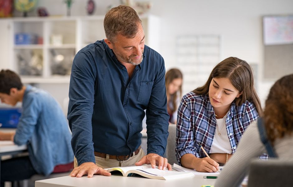 a male teacher engaging in literacy leadership